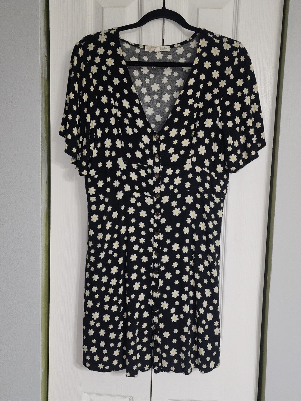 Black Rayon V-Neck Top with White With Yellow Daisy Print Sizing In Description